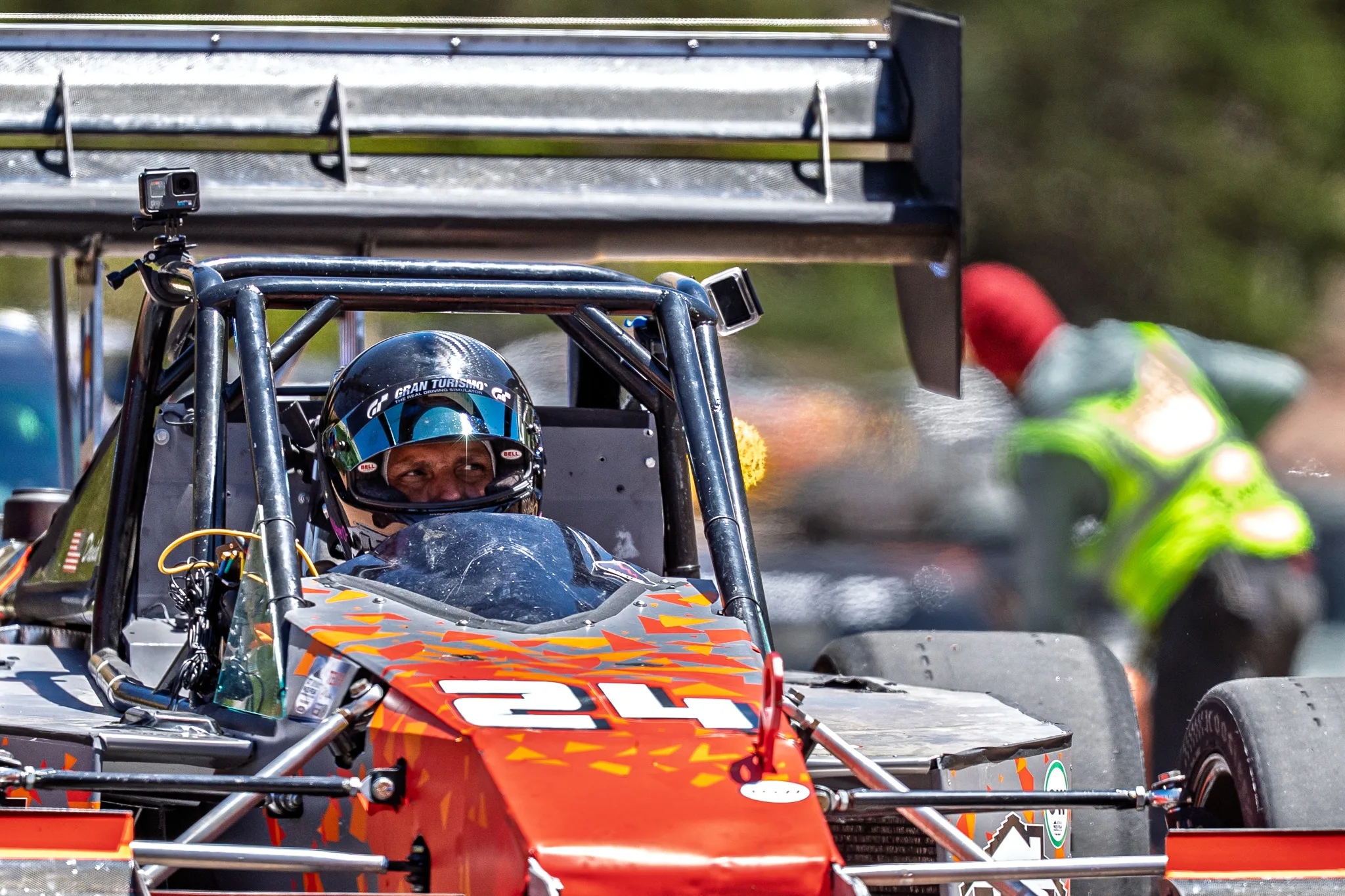 David Meyer in his helmet in the #24 O'Maley Special open-wheeler at the 2025 Pikes Peak International Hill Climb