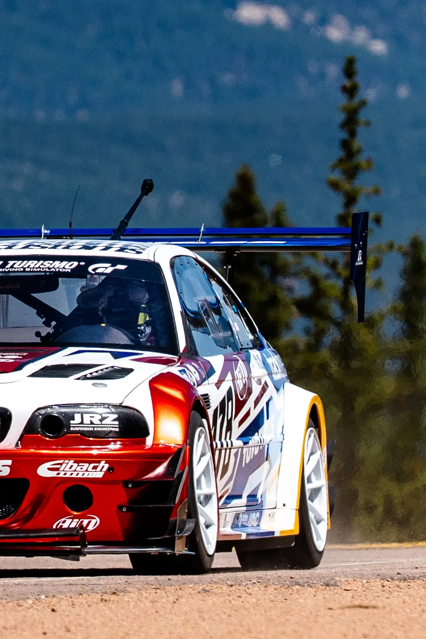 Tom Tang's red, white and blue #178 2002 BMW E46 M3 at the 2025 Pikes Peak International Hill Climb, Unlimited division