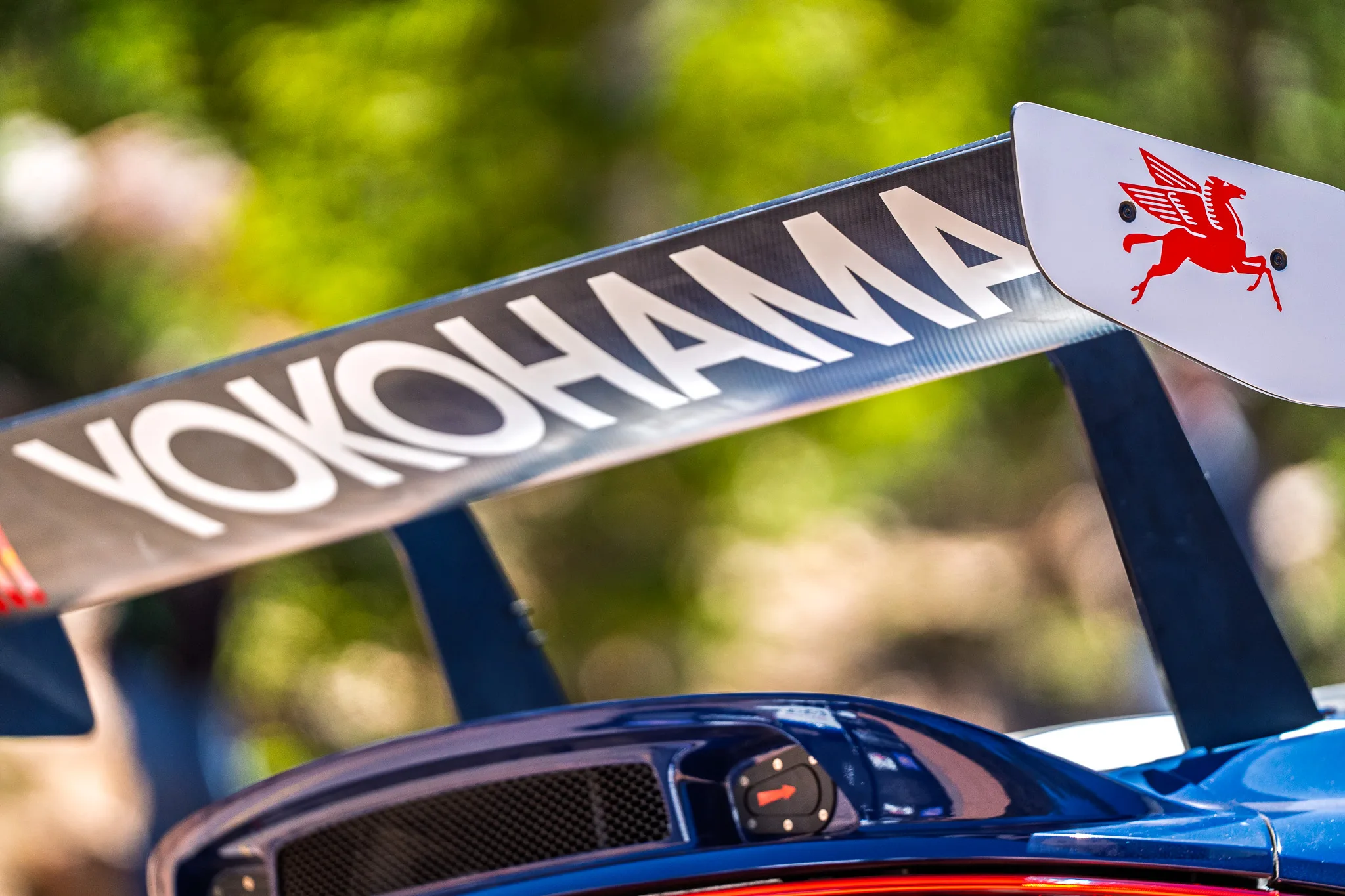 Yokohama rear wing detail on navy bodywork at the 2025 Pikes Peak International Hill Climb